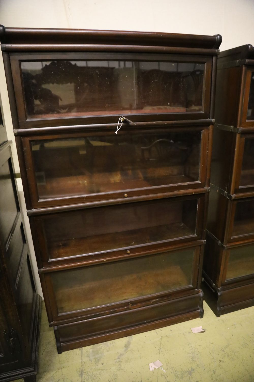 A set of two Globe Wernicke four section mahogany bookcases and a three section Globe Wernicke bookcase, width 86cm, depth 27cm, larges
